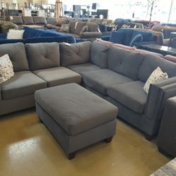 Grey Velvet Sectional And Ottoman 