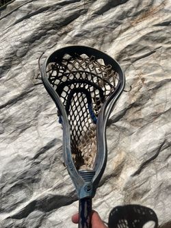 Navy Lacrosse stick with custom pocket.