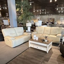 Beige power reclining couch and loveseat