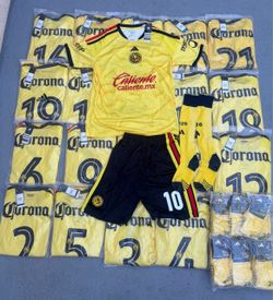 20 sets Club America home and away and Barcelona Soccer uniforms ready to pick up or i can ship them any where in the US 40$ each set includes jerseys