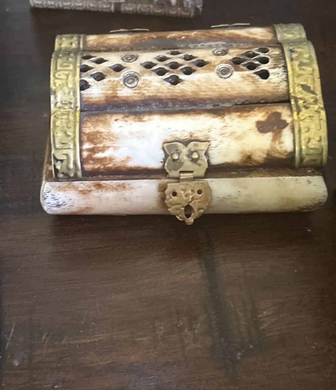 vintage camel bone and brass trinket box. It is typically handcrafted, often in India, and features genuine bone that has been smoothed and polished.