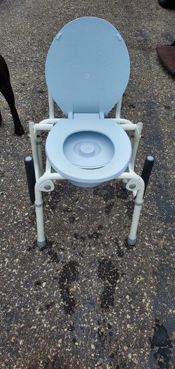 Merits bed side commode
