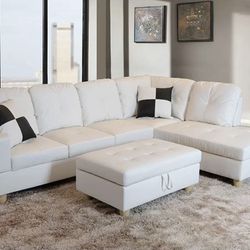 BRAND NEW WHITE LEATHER COUCH. STILL IN BOX!