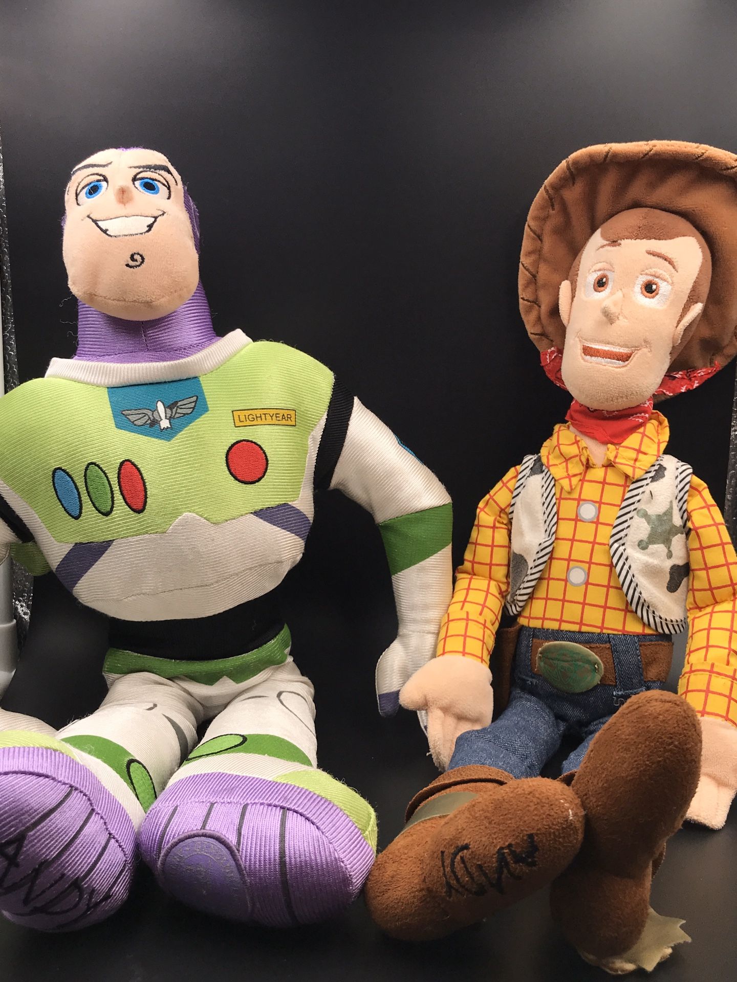 Buzz and woodie Disney dolls