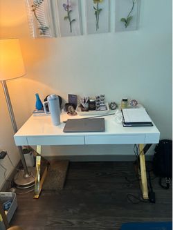 White desk with “x” gold legs