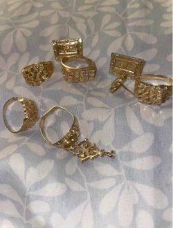 Gold nugget rings and last supper earrings