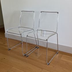 2 clear acrylic chairs