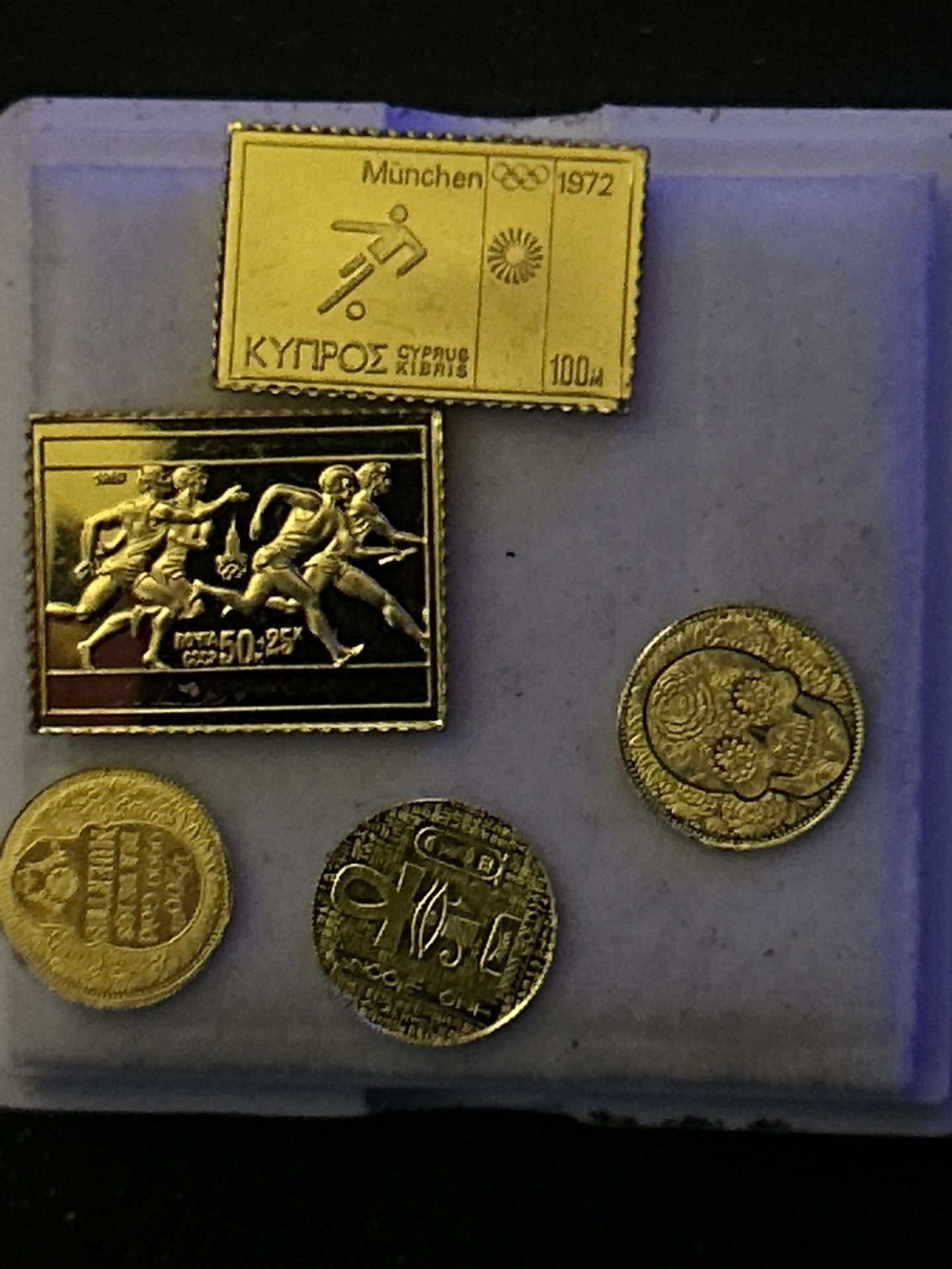 Three individual 1/200th gold rounds and vintage 24k over sterling silver stamps