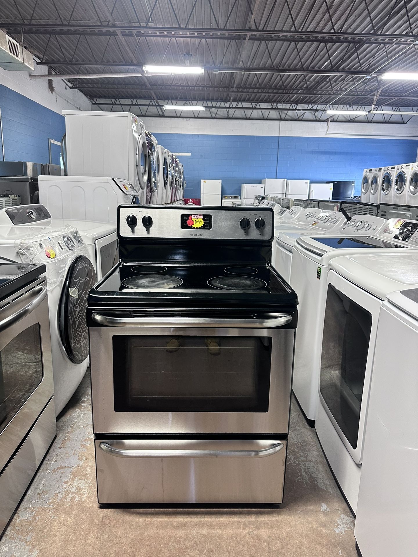 Frigidaire )Electric stove, works perfectly, is very clean, and comes with a warranty.