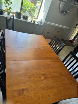 Finished and black kitchen table with 6 chairs