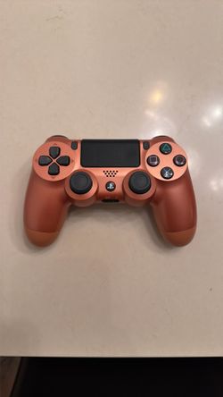 PS4 controllers. Golden orange and black