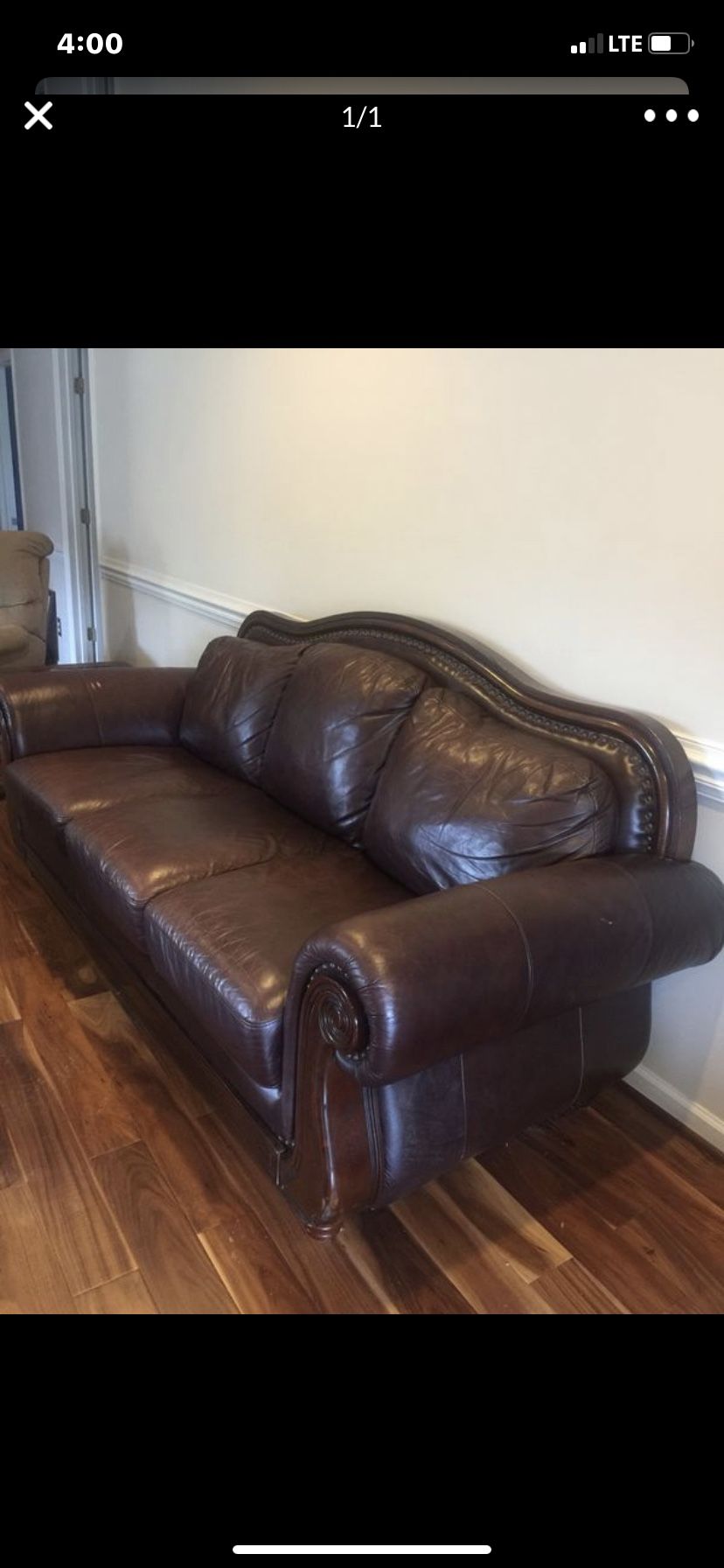 Dark brown studded leather & wood couch