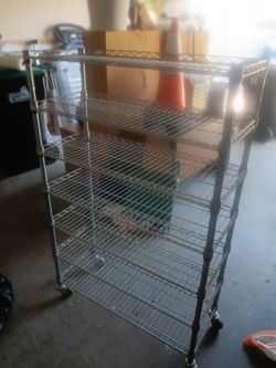 Selling a metal wire mesh shelf, 7 levels, 4ft 8in high, 14in depth and 3ft wide. Great condition. Selling for $35.