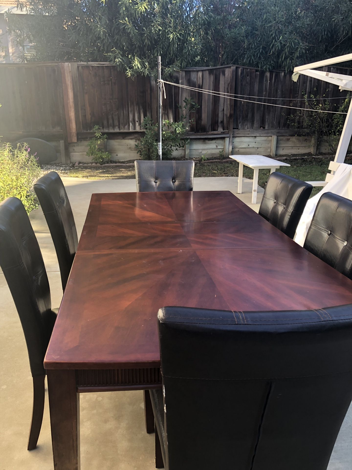 sizable dining table with 6 dining chairs