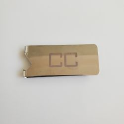 money clip/bottle opener

Initials "CC"