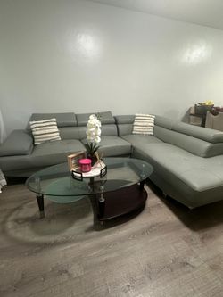 Sofa seccional "L" de cuero gris