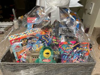 Basket filled with Pokemon, collectibles, and fidgets.