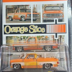 M2 MACHINES ORANGE SLICE 76 GMC SIERRA
