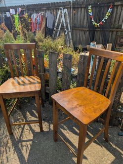 Two solid wood bar height chairs - $20