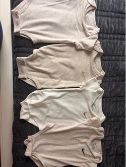 Nike onesies in neutral colors