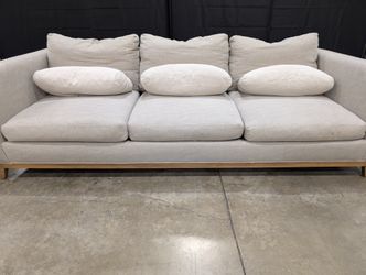 Crate & Barrel Oatmeal Fabric Sofa with Wood Base and Bolster Pillows