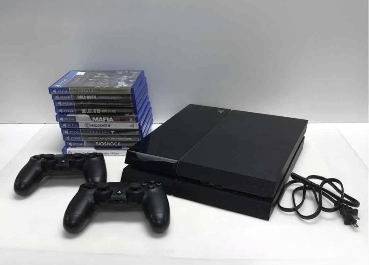 ps4 with 2 controllers and 10 games