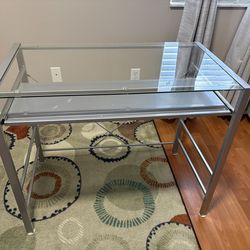 Glass topped table with metal frame