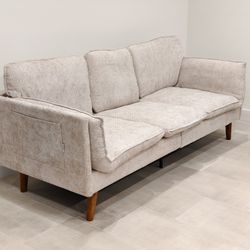 New Open Box Assembled 3 Seater Couch. It's A White Or Tanish Color.
