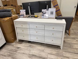 New white dresser has small chip