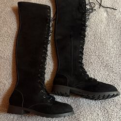 Woman’s Thigh High Lace Up Boots