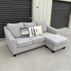 Gray Reversible Sectional Couch. Free Delivery!
