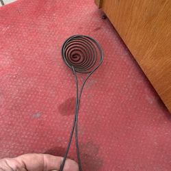 This is a vintage coiled wire egg separator.  It can be used to separate the egg yolk from the white, strain liquids, or lift eggs out of boiling wate