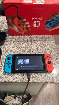 Nintendo Switch w B/R JoyCon V2, two games, micro SD card, and case
