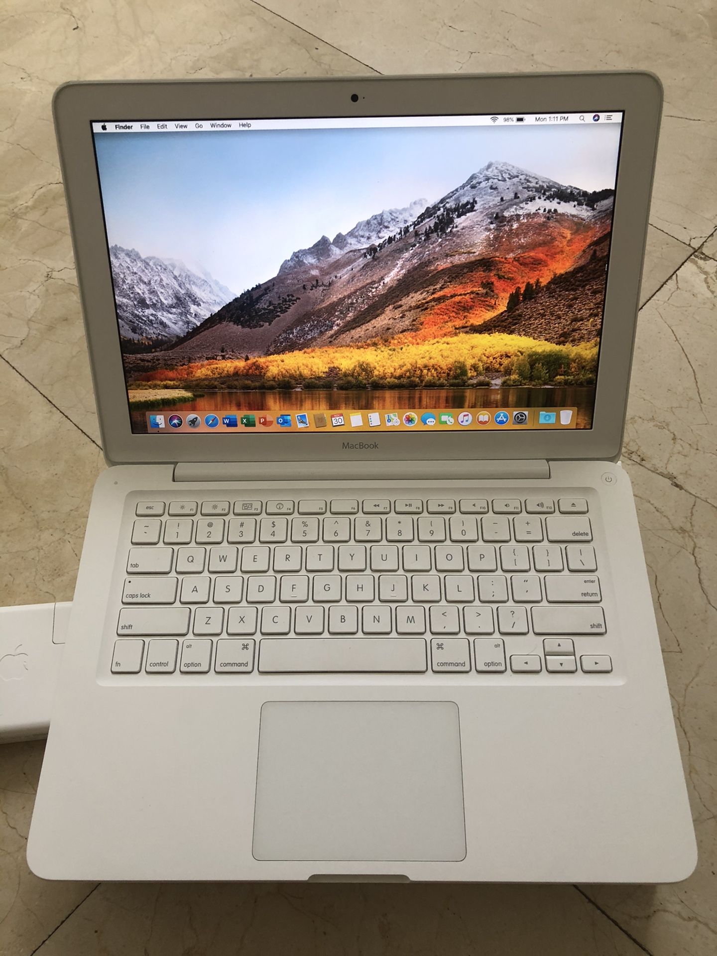 White Apple MacBook 13” laptop A1342 Core2 Duo 2.4 GHz 4GB RAM 128GB SSD macOS High Sierra. It comes with Office Pro 2019 is installed.