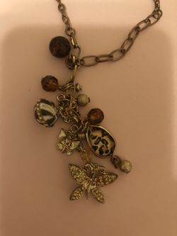 18” Guess gold necklace with dangle charms (cheetah print ones and gold butterflies). Never worn!