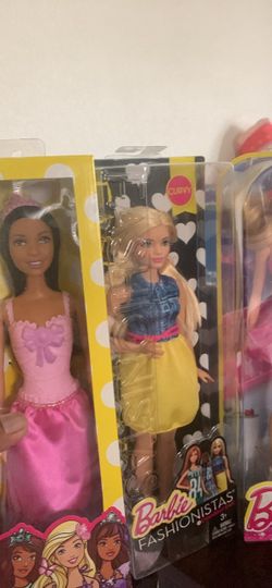 7 different Barbie dolls