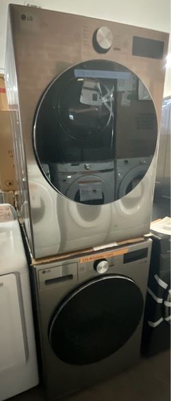 NEW  LG 5 Cu Ft Smart Front Load Washer and 7 Cu Ft Gas Dryer Set, designed to stack in Graphite Steel.