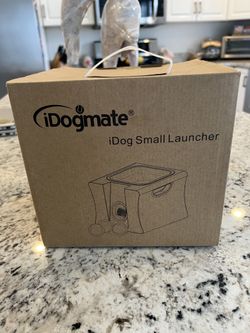 Interactive ball launcher, IDM400 automatic ball thrower with rechargeable batteries, remote, and ball new in box