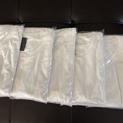Six white  long sleeve tee shirts medium