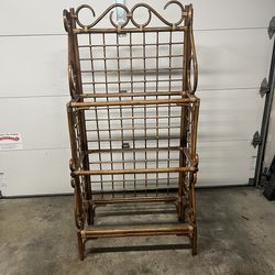 1960s Mid-Century Modern vintage rattan étagère featuring a three-tiered design