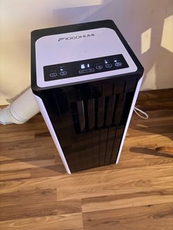 FIOGOHUMI 12,000 BTU Portable Air Conditioner (Model A030BDJ).