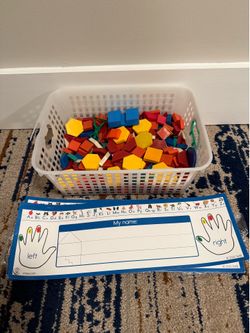 Basket of geometric shapes and name tags with letters