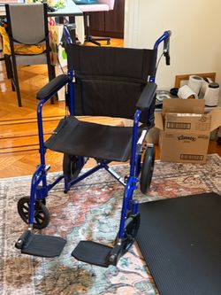 Transfer wheelchair with extra cushions