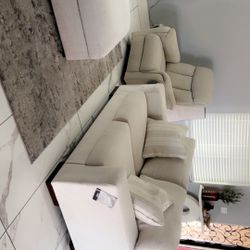 Recliner, love seat and ottoman with storage.  New without box