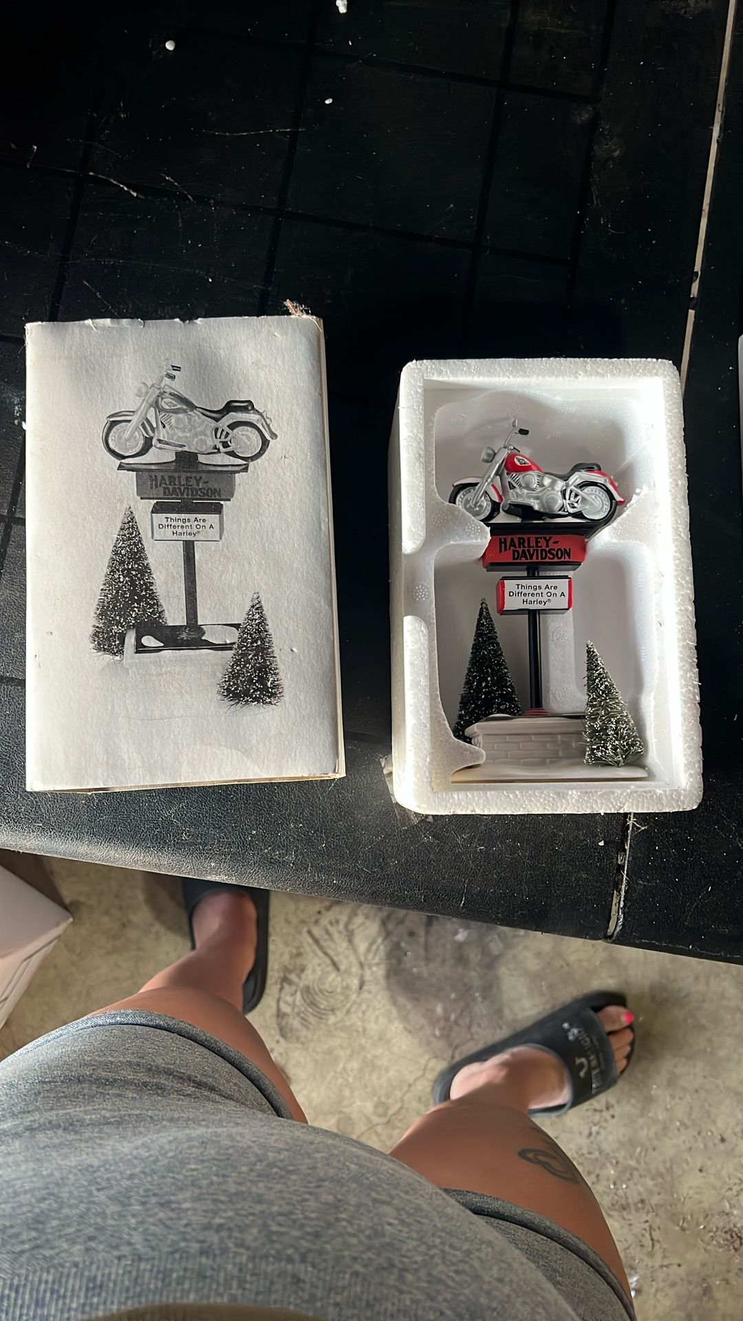 This is a Department 56 Original Snow Village Harley-Davidson Sign. 
