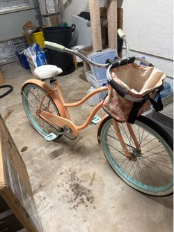 Peach coloured bike, great condition with kickstand