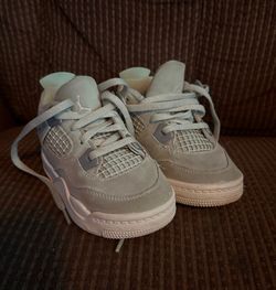 pair of Jordan 4 Retro TD/PS Abundance Seafoam Green toddler sneakers size 8.5