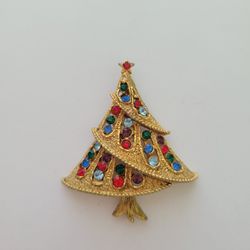 Vintage JJ Christmas Tree Brooch Pin Textured Gold Tone & Rhinestones. It has some wear on the back.