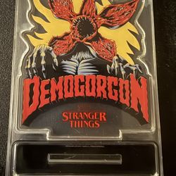 Netflix Stranger Things Demogorgon Plastic Picture Flat Stand. Brand New. Approximately 2 Inches Tall.
