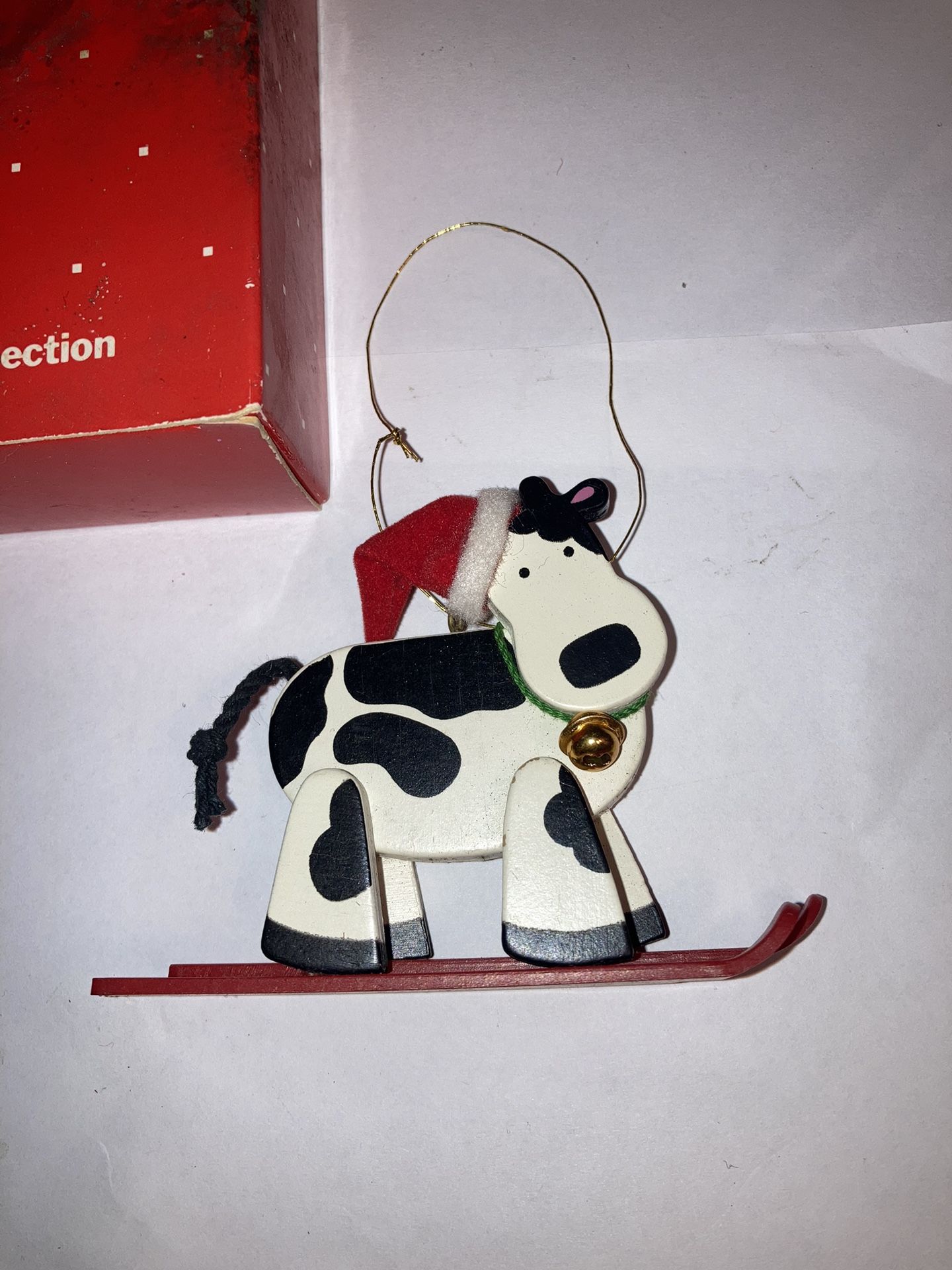 AVON Holly Jolly Skiing Cow Christmas Ornament
